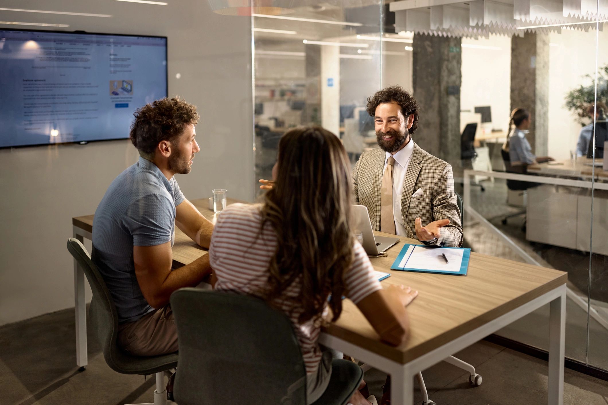 Consultant meeting with clients in an office
